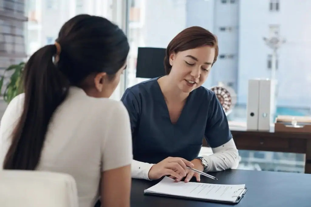 A provider speaks to a patient about psychedelic therapy.